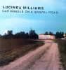 1998 Car Wheels on a Gravel Road