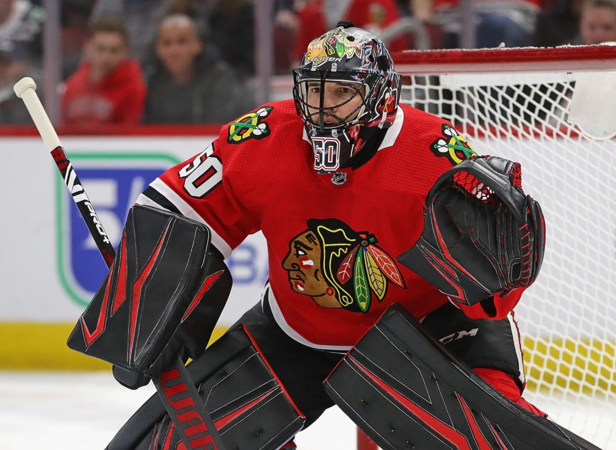 Goaltender Corey Crawford, who backstopped Chicago to two Stanley Cups,  retires